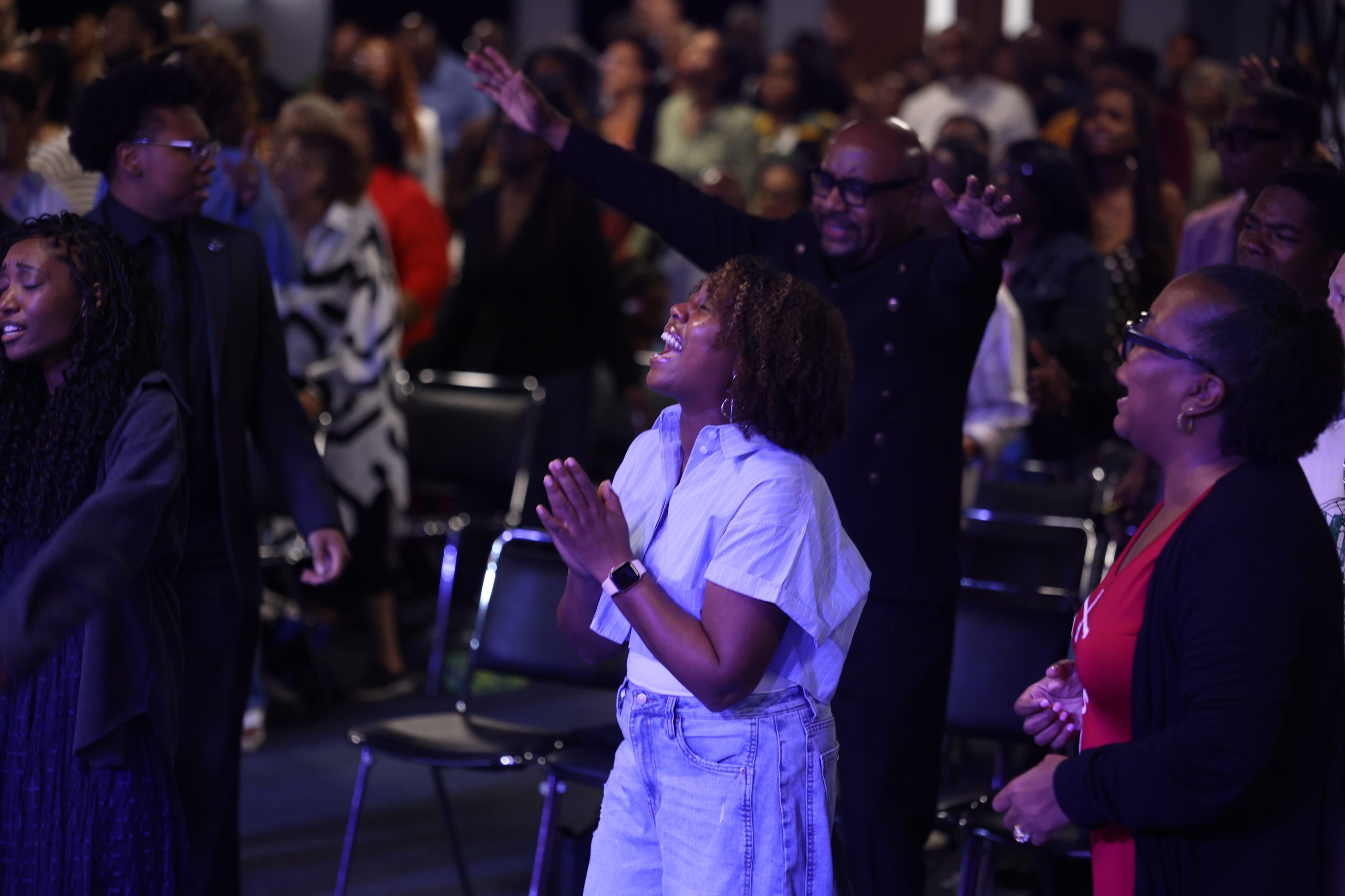 Hands raised in worship — generational generosity at Embassy